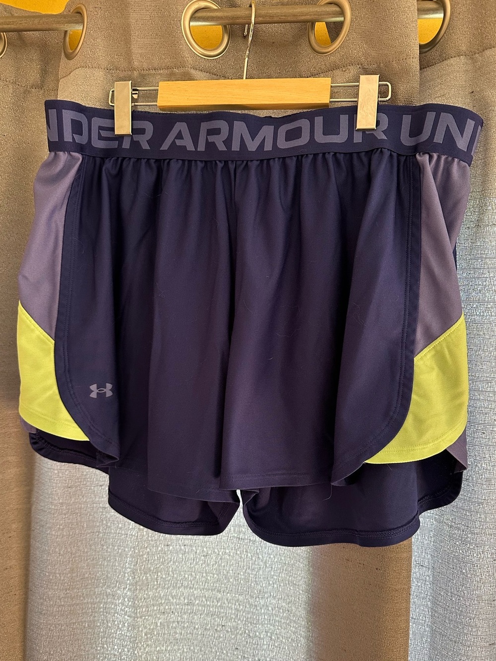 Under Armour Women's Dark Blue Running Shorts with highlighter yellow accents